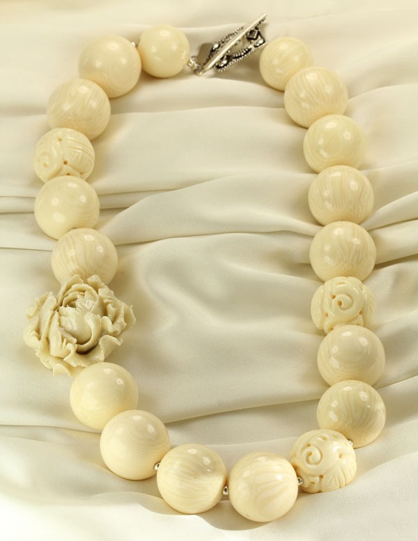 Carved Bone Necklace with Coral Flower