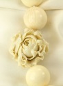 Carved Bone Necklace with Coral Flower