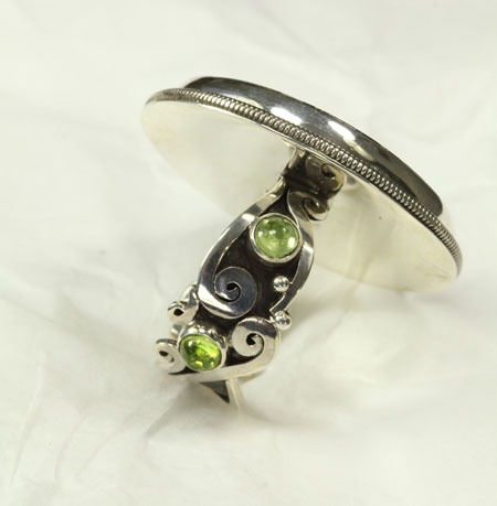 Echo of the Dreamer Rhyolite Ring with Peridot 